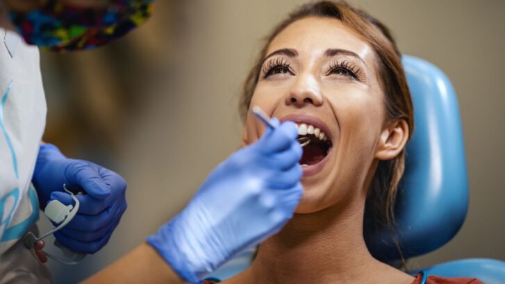 Patient undergoing root canal treatment to relieve tooth pain and save a natural tooth.