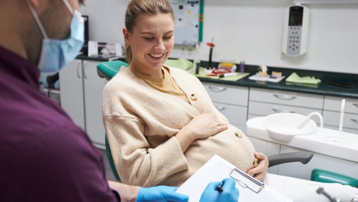 Pregnant woman having a dental checkup at a clinic.